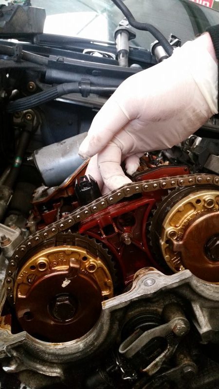 Bmw hand feeling the slack on timing chain